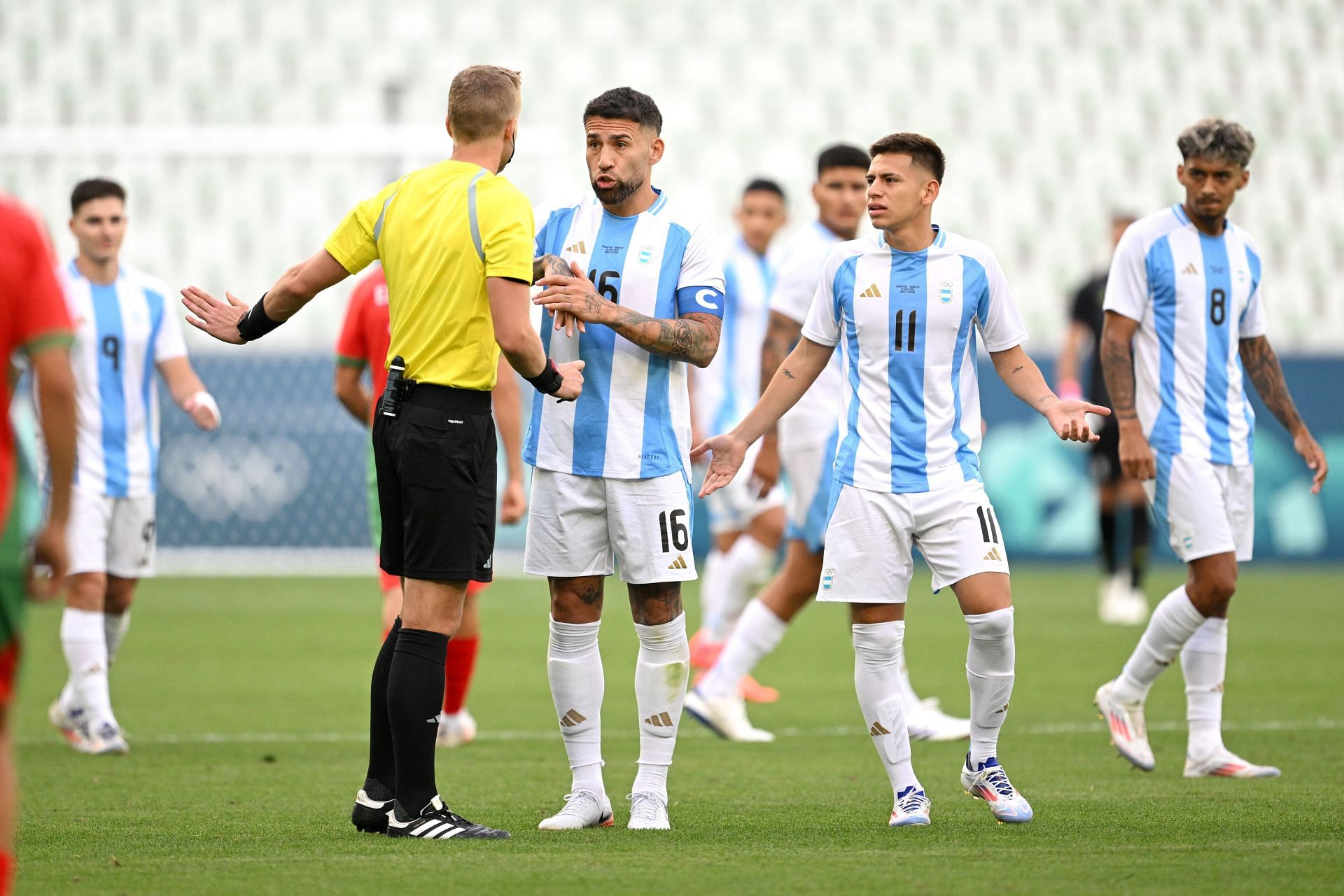 Team Argentina reacts towards referee Glenn Nyberg after VAR disallowed Team Argentina's second goal - Getty Images